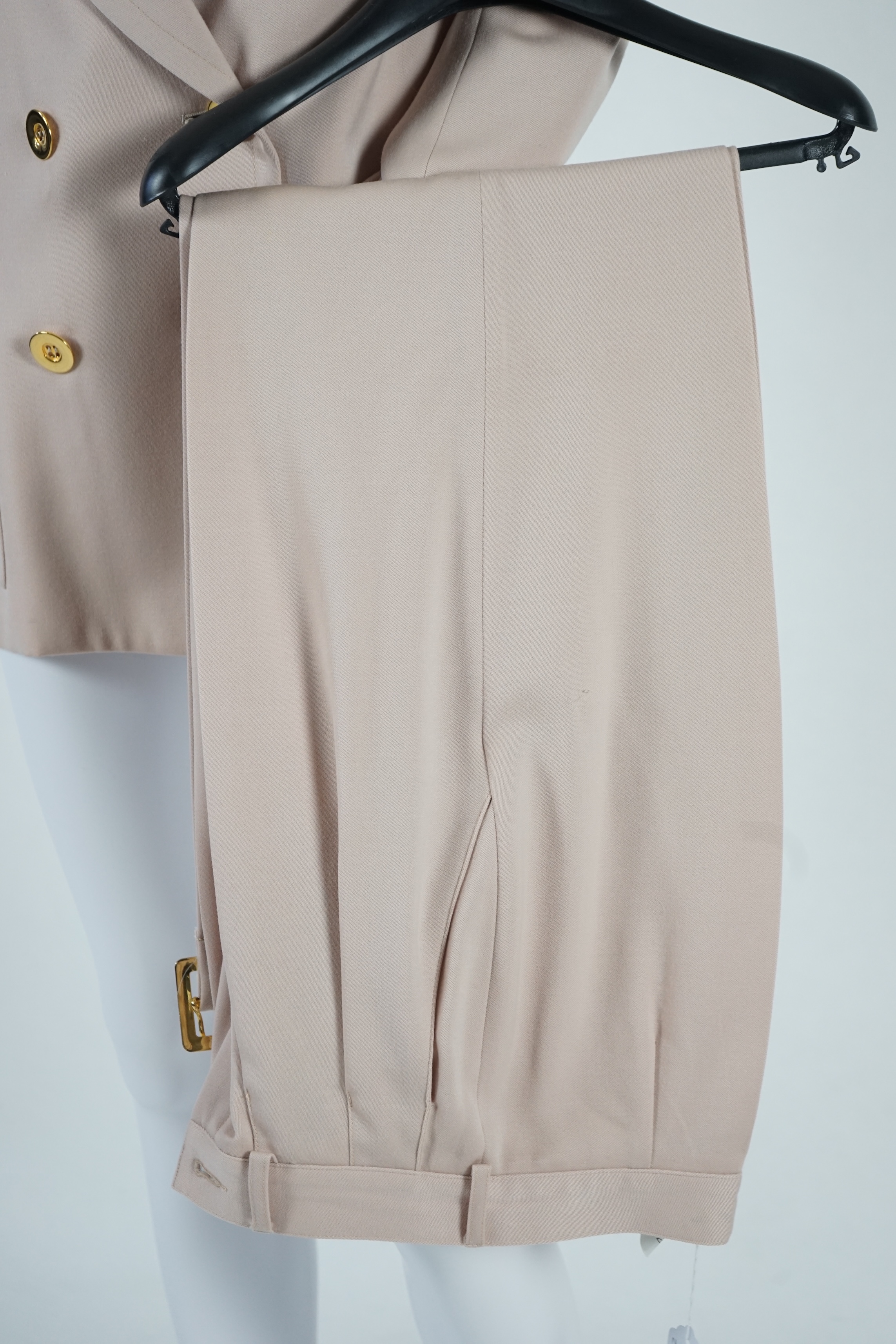 Two vintage Yves Saint Laurent variation lady's suits with both matching skirt and trousers, F 38 (UK 10). Please note alterations to make the waist smaller may have been carried out on some of the skirts. Proceeds to Ha